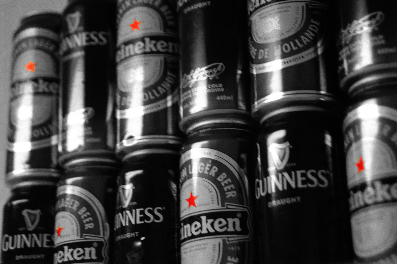 A row of at least fourteen beer cans, stacked two-high