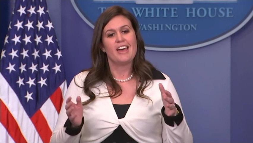 Sarah Huckabee-Sanders briefing the White House press corps